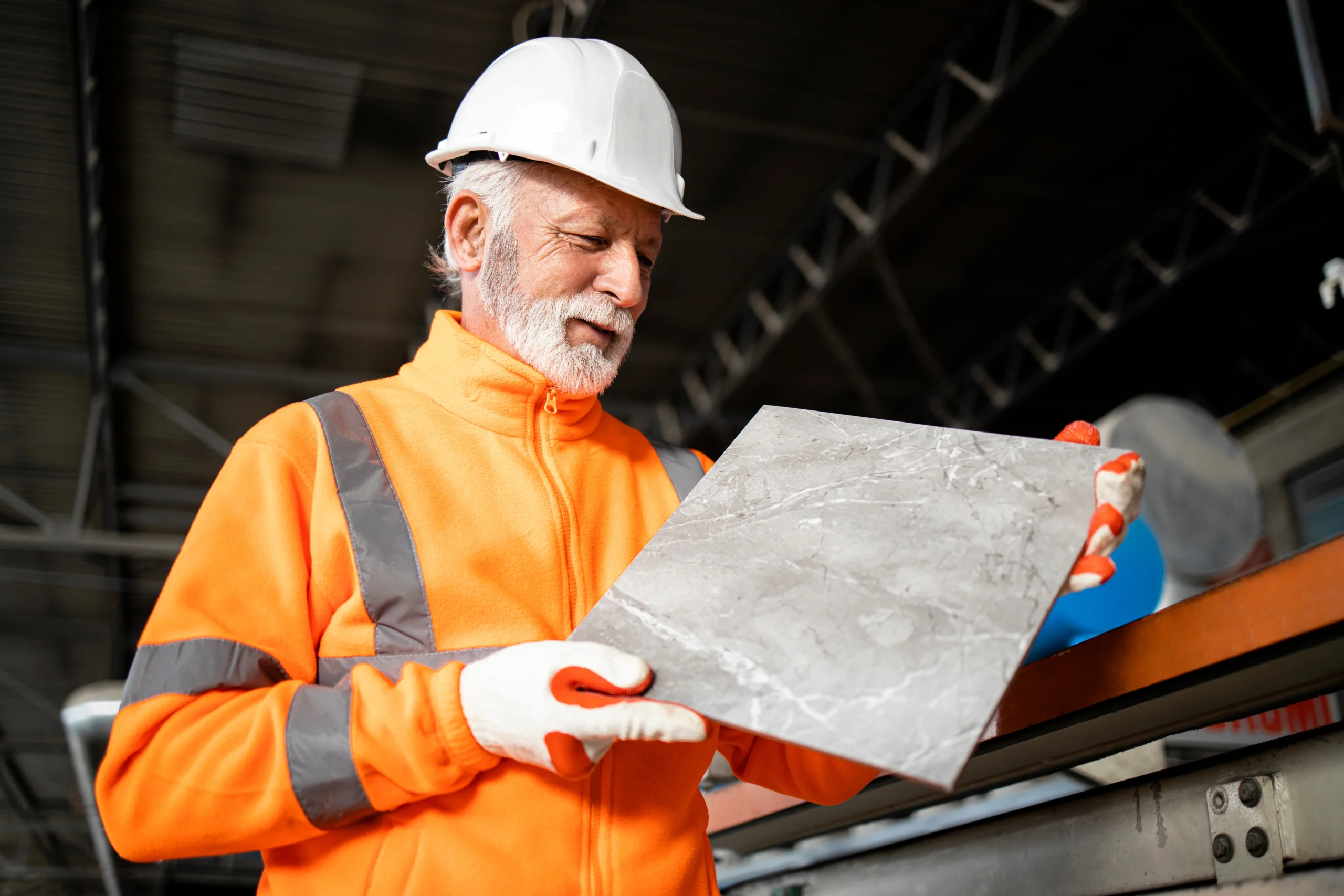 Tradie checking the quality of the tile